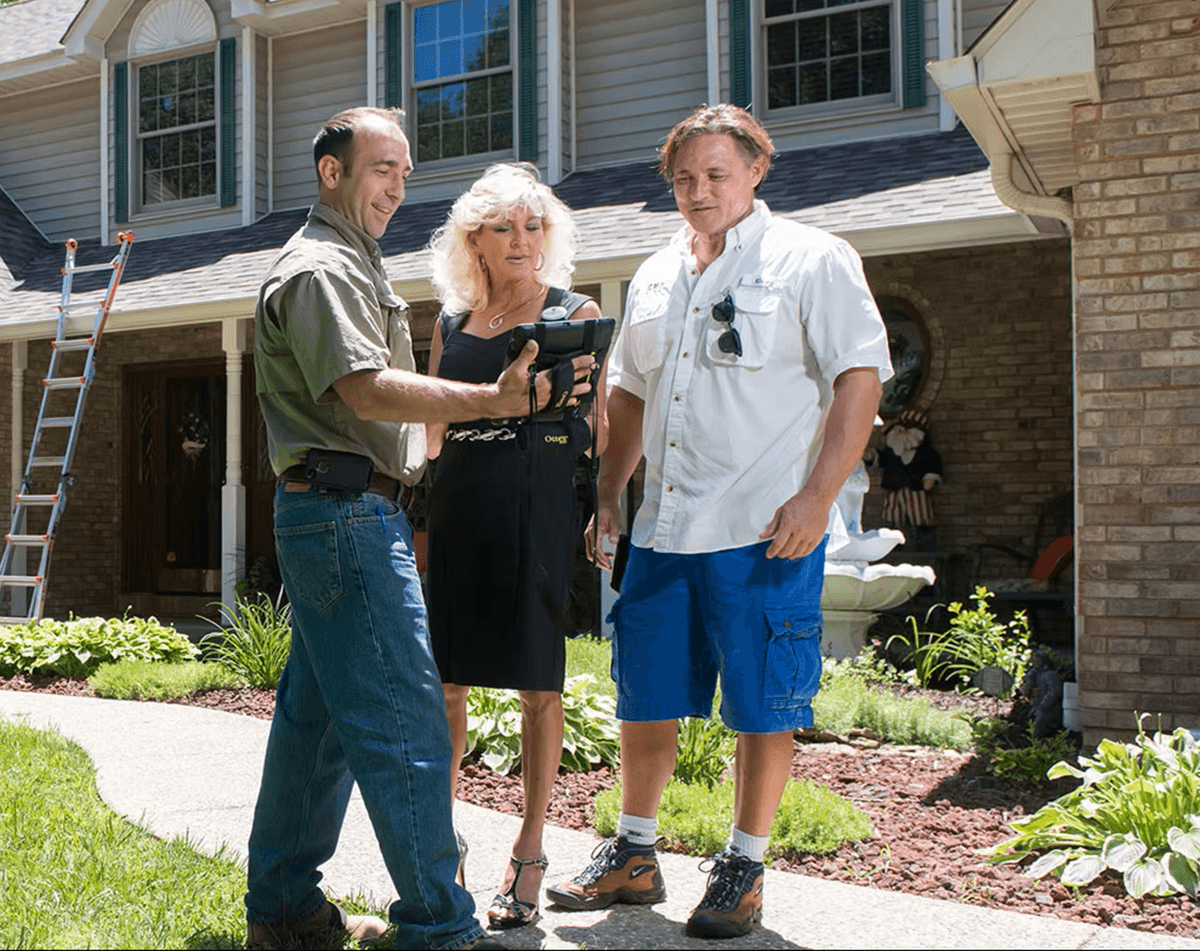 Chris Dabin with a homeowner after a completed inspection